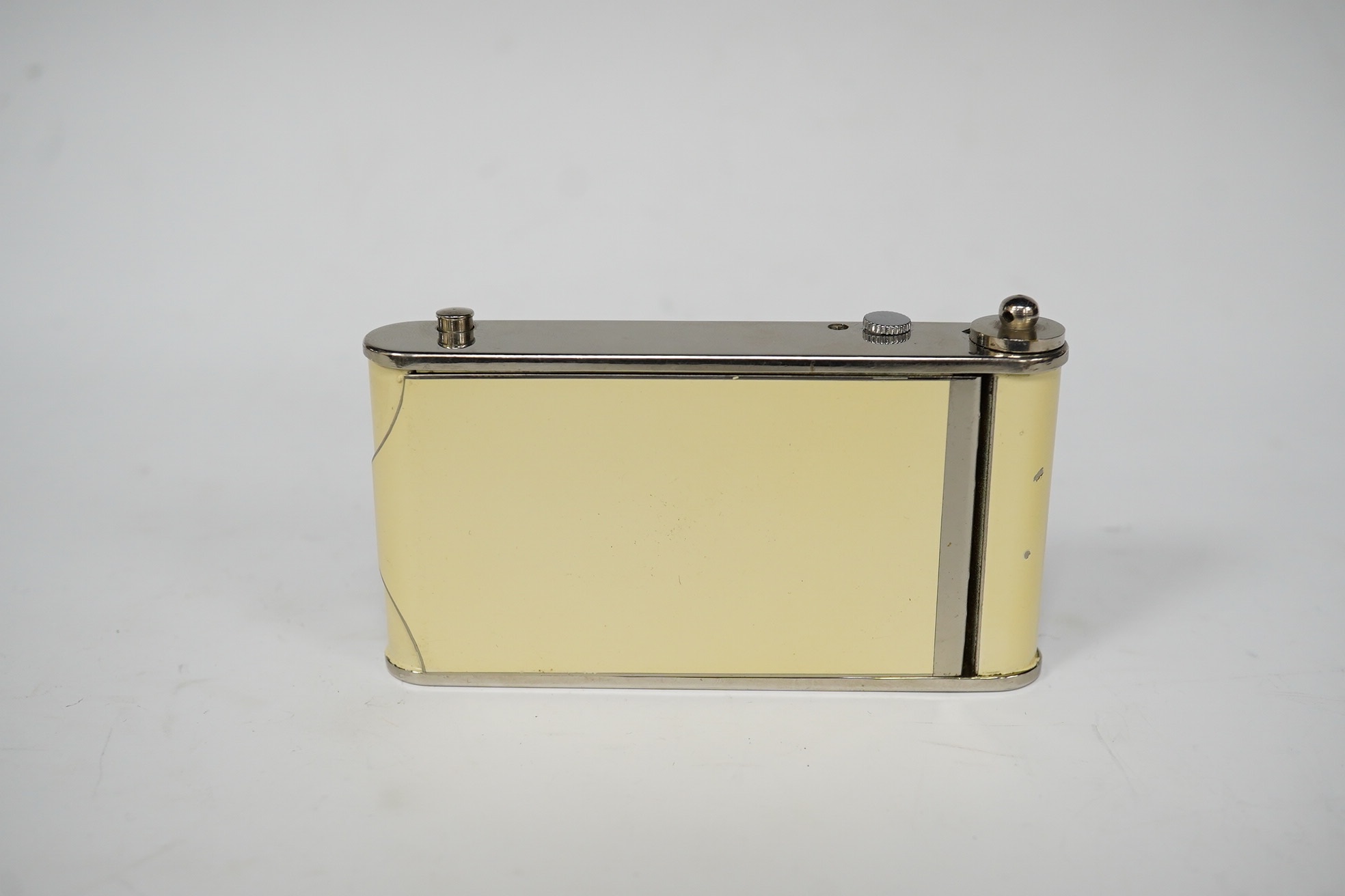 An Art Deco enamelled and chromed combined compact, a cigarette case and a timepiece, 9.5cm. Condition - minor flaking, movement going